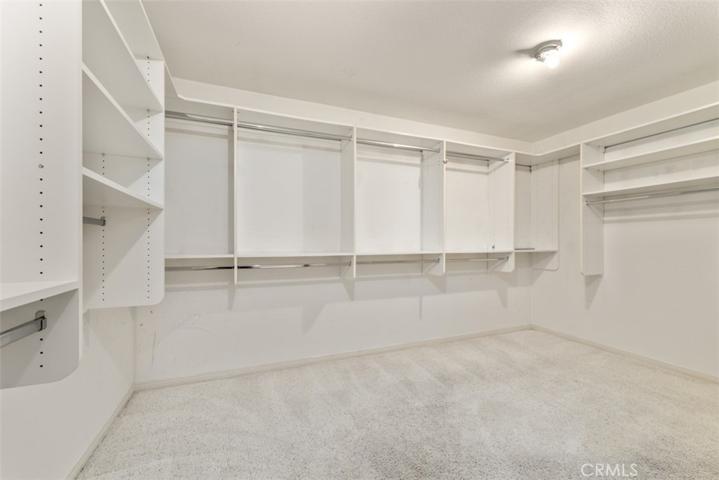 Primary bedroom walk-in closet
