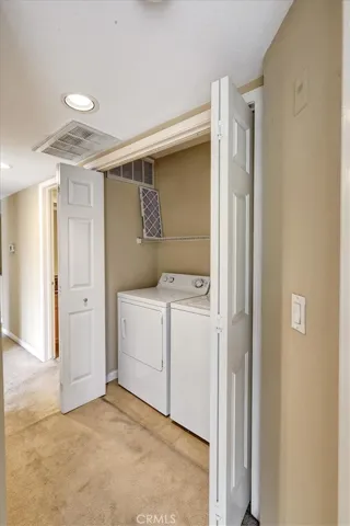 Doors open, washer and dryer remains