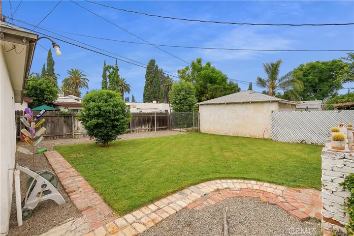 View of backyard from drivewaty.