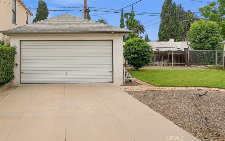 2-car detached garage with lovely yard to extend garage or build up like neighbor did to accommodate an ADU.