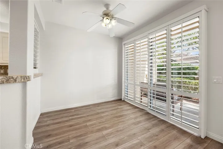 Dining room has ceiling fan.