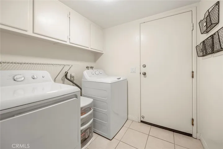 Inside Laundry room with brand NEW Washer and Dryer.