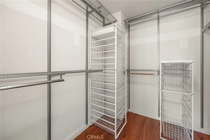 Custom Closet Organizers in walk-in closet.