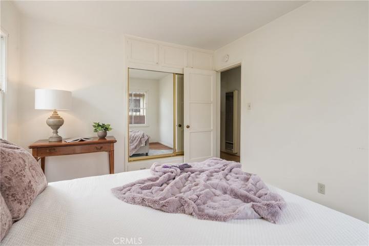 Bedroom #2, showing mirrored closets and door