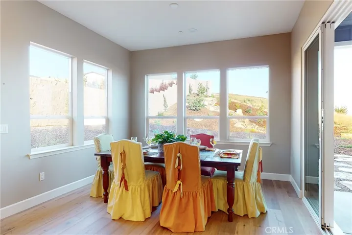Dining Room just off the Kitchen with a view of the Dry Creek Bed and all the additional plants, shrubs & trees