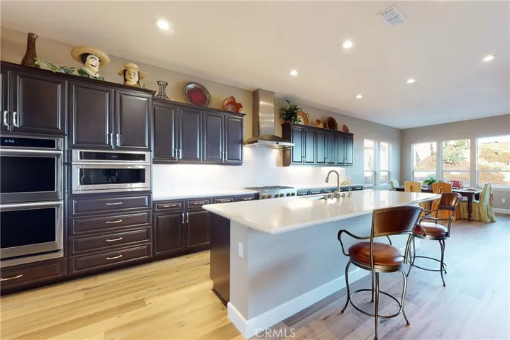 View from Kitchen to dining area with a view of the dry creek bed in the backyard
