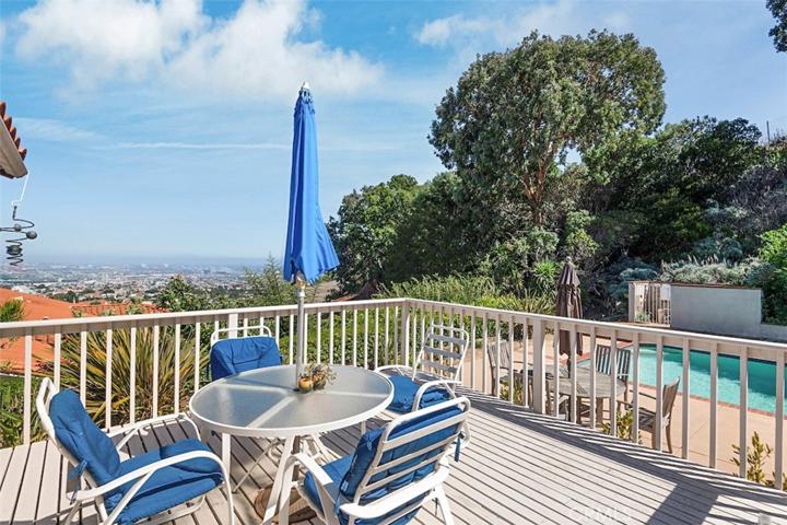 This deck is off the dining area and features pool access and an excellent view
