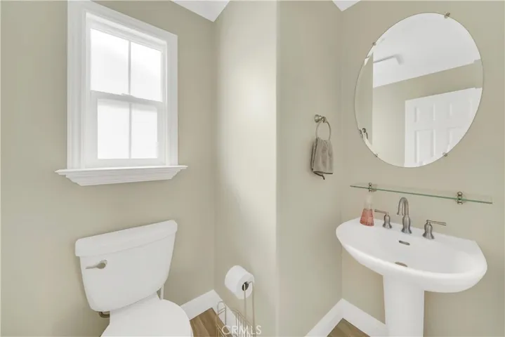 Downstairs Powder Room located between Main Entrance and Kitchen