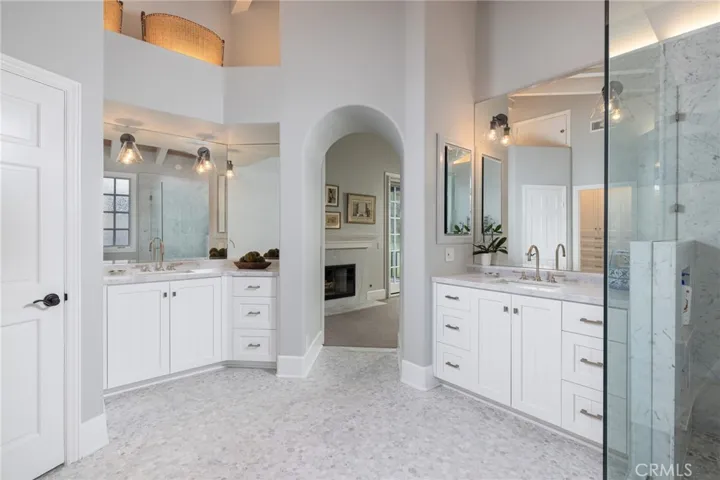 Separate vanities and vaulted ceilings