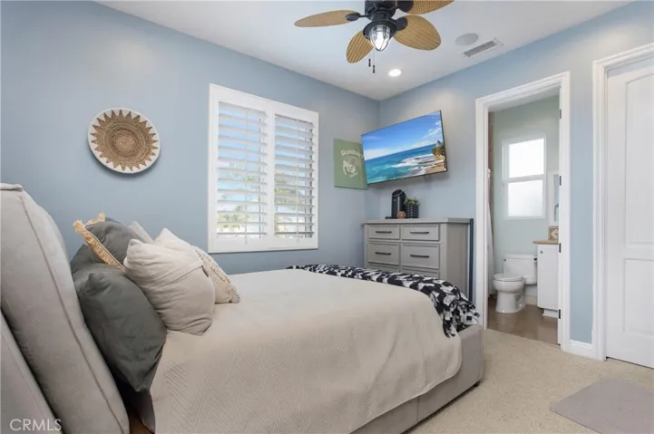 Main house- secondary bedroom with en suite bathroom, walk in closet and built in desk