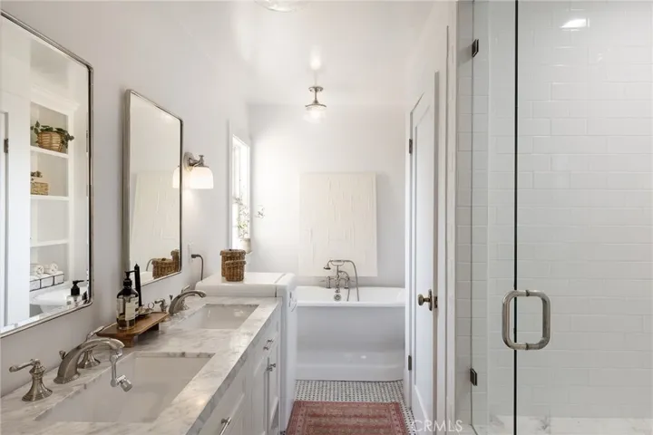 Primary Suite Bathwith separate tub/shower toilet closet