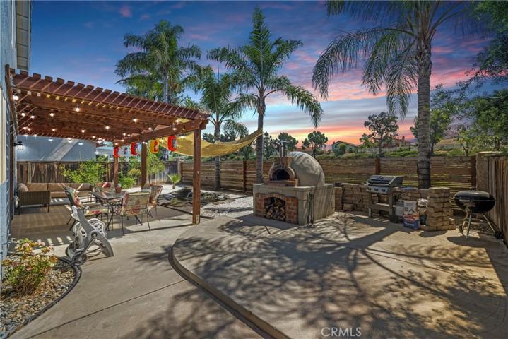 Backyard with koi pond and pompeii brick pizza oven