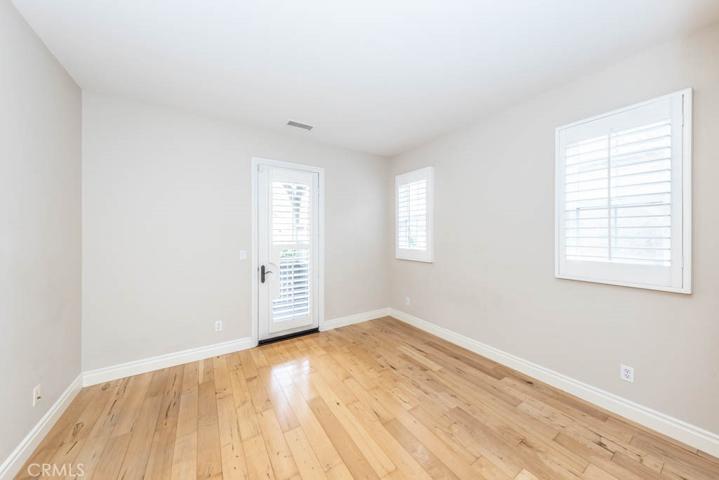 Upstairs bedroom with French door to deck