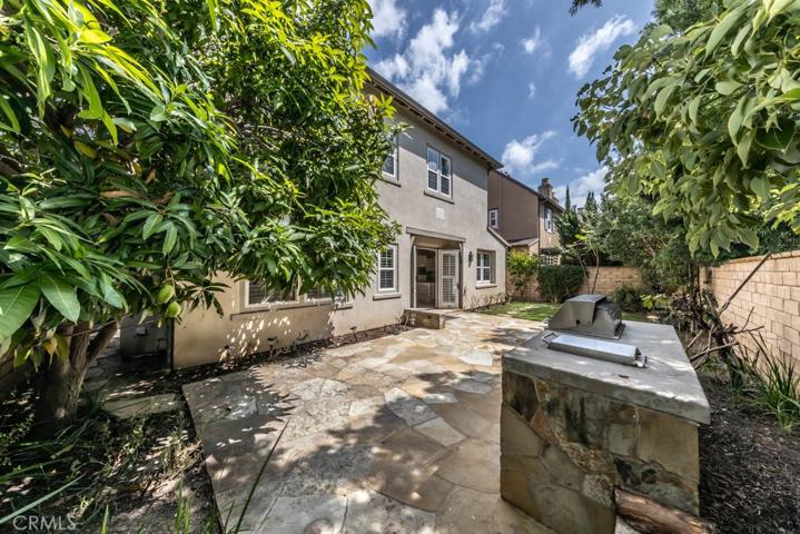 Backyard featuring built-in BBQ