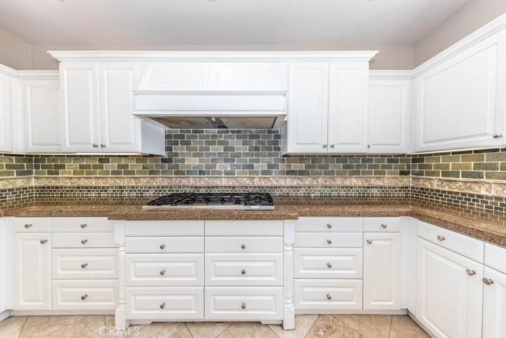Kitchen with stainless steel appliances and granite counters