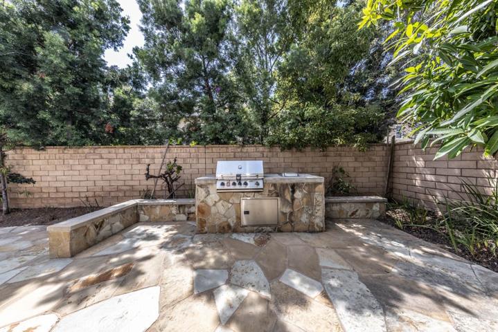 Backyard featuring built-in BBQ