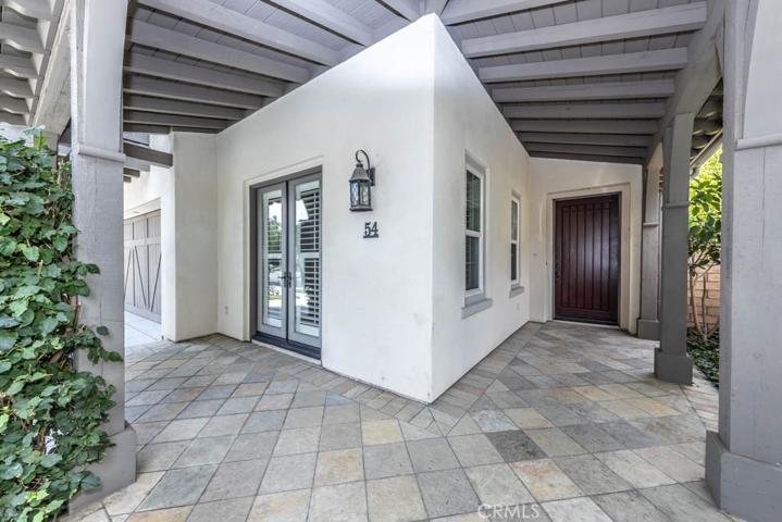 Entry with outside patio, French doors into den/office