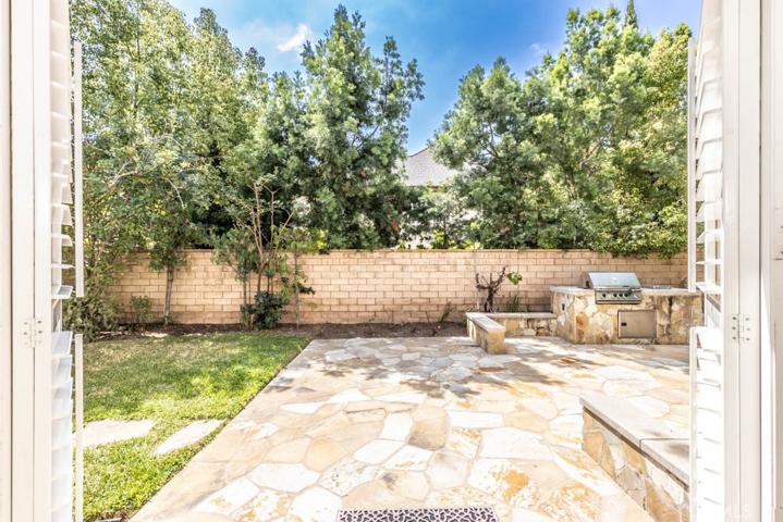 Backyard featuring built-in BBQ