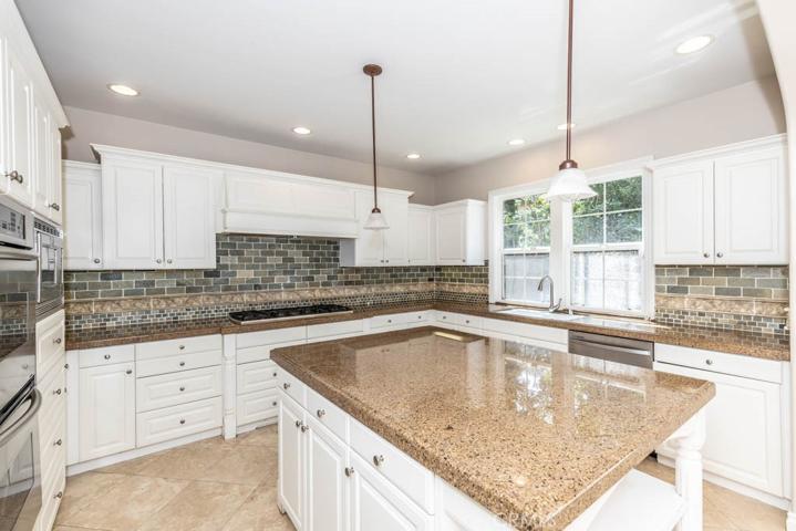 Kitchen with stainless steel appliances and granite counters