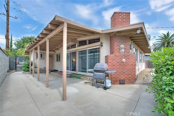 Checkout this great outdoor area with a little patio furniture you can enjoy outdoor living.