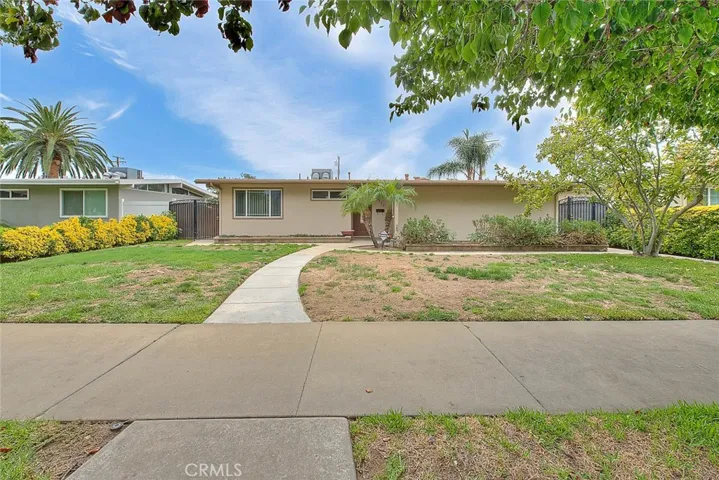 Beautifully landscaped front yard with mature trees