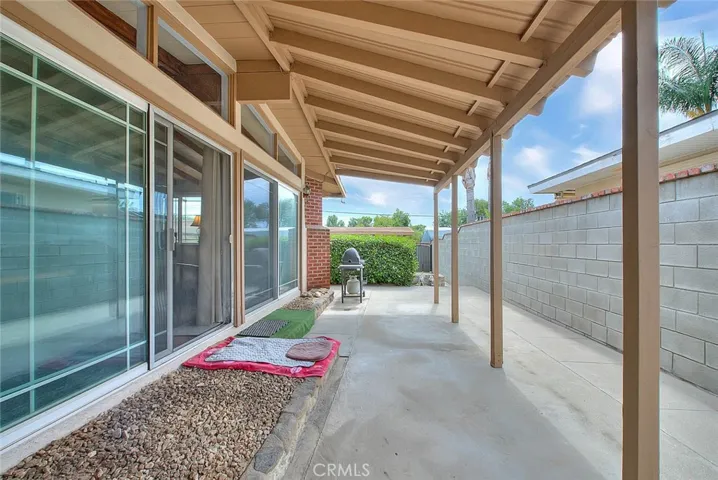 Beautiful covered patio off of the living room and kitchen area.