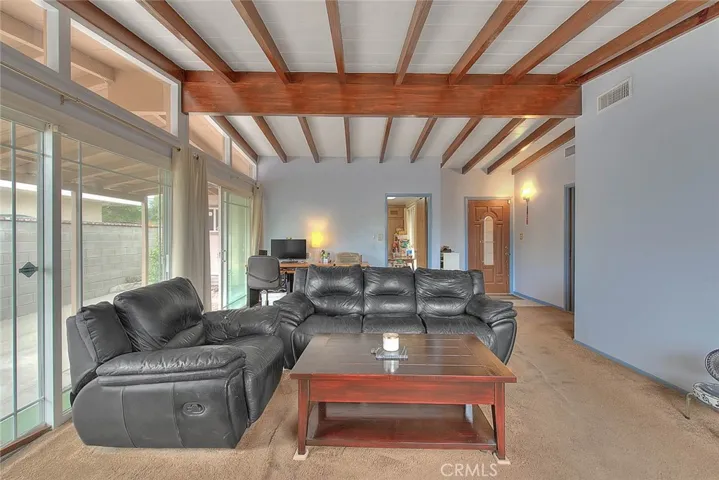 Wall of sliding glass doors and windows brings natural lighting and great outdoor living.
