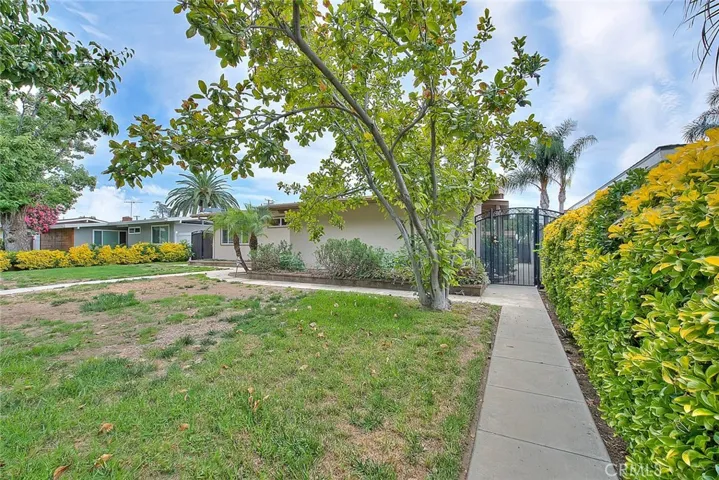 Nice wrought iron gates lead to backyard