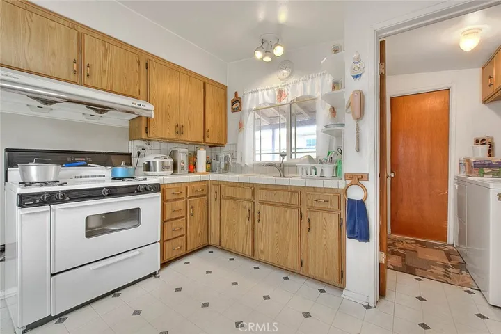 Laundry room is off the kitchen and a powder bath.