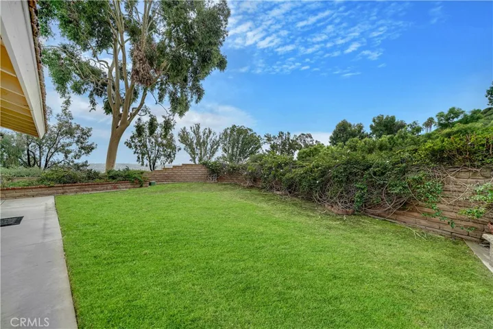 Pleasant side yard is ready to sculpt into your dream retreat!