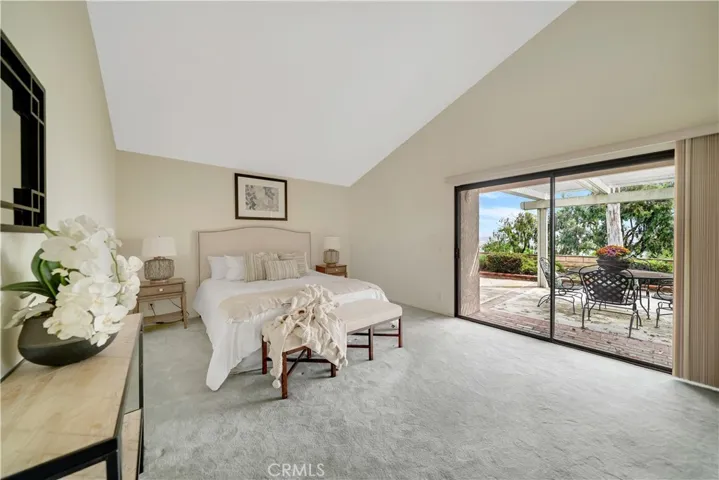 Master bedroom has high ceilings, and a private patio, with sliding door access too.