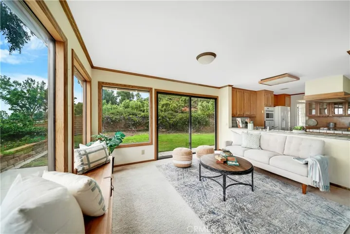 So much space!  What a fun family room! Whoever is in the kitchen doesn't miss a thing.