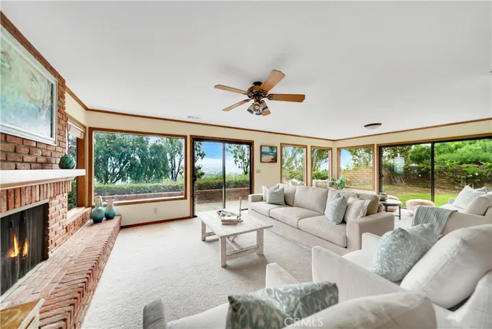 Picturesque windows surround the expanded family room. A cool breeze flows through home all day long.