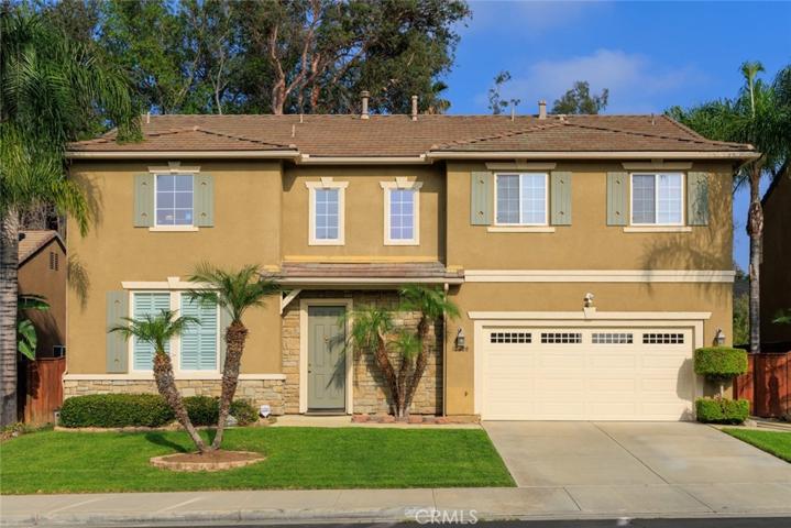 Queen Palms flank this prestigious Victoria Grove stunner!