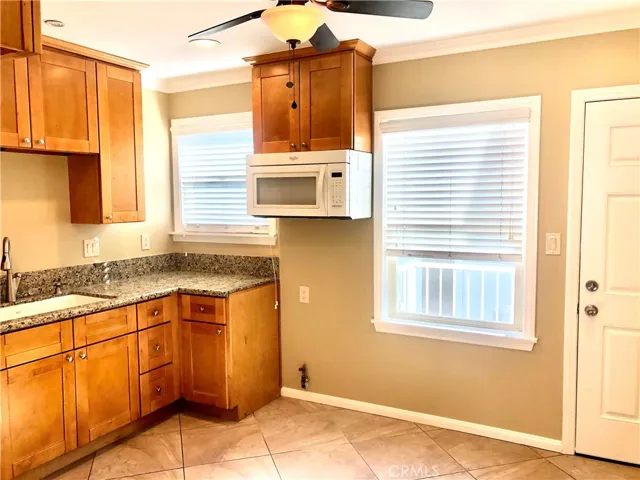 Remodeled Kitchens with granite counters, crown molding, ceiling fans