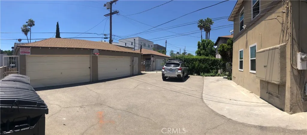4 garage stalls & plenty of additional parking