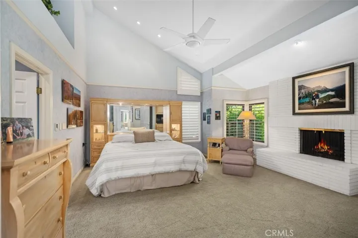 Spacious primary suite has fireplace and sitting area...