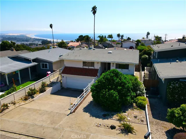 Notice the concrete walkway around the house at the garage....