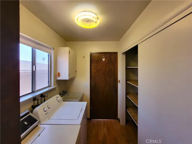 Adjacent to Master Bath is a full blown Utility Room with Washer, Dryer, Sink, Cabinet, Pantry and Floor to Ceiling Closet Space!!