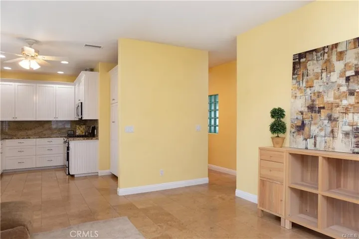 View from front room towards kitchen and hallway