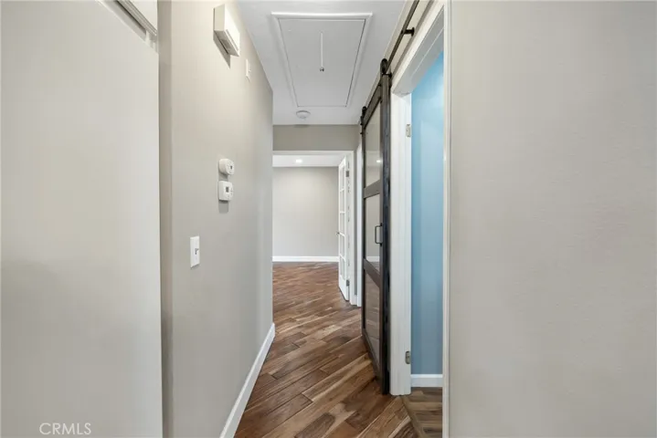 Hallway with Barn Door to Laundry Room