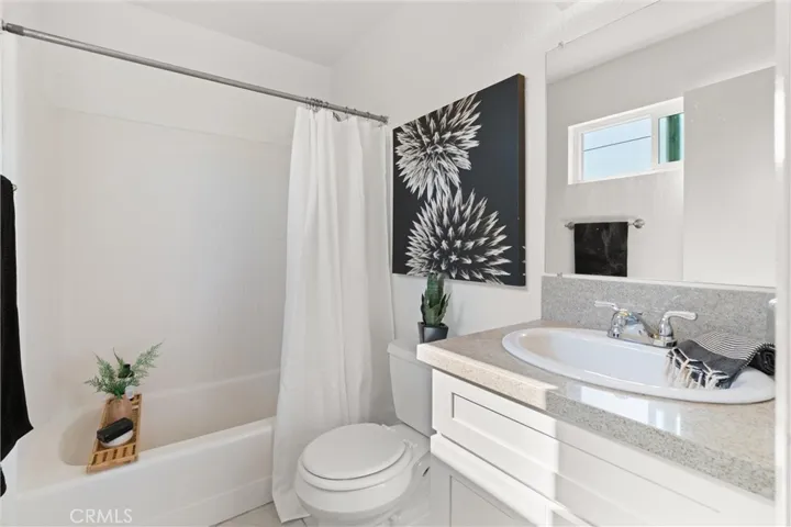 Reimagined bathroom with quartz counters