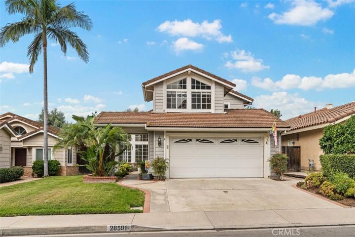 Front of home, with garage, driveway & street parking