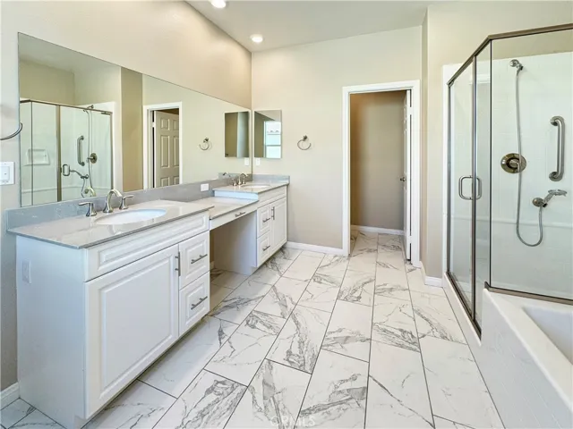 Master bathroom with Separate Shower & Tub and Dual Sinks