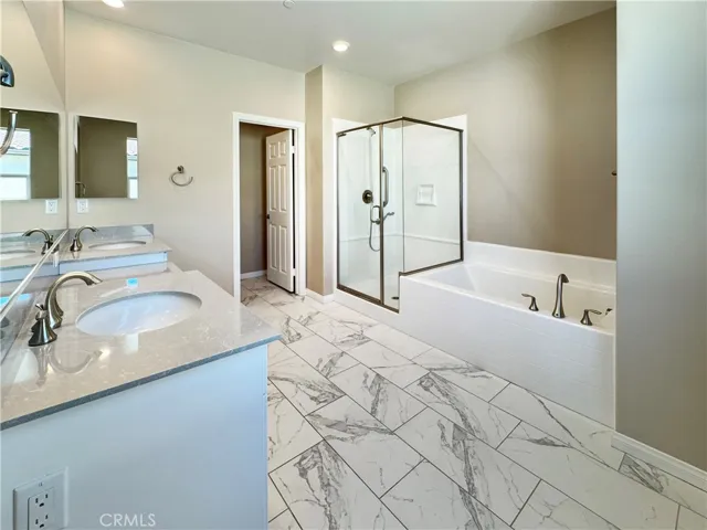 Master bathroom with Separate Shower & Tub and Dual Sinks