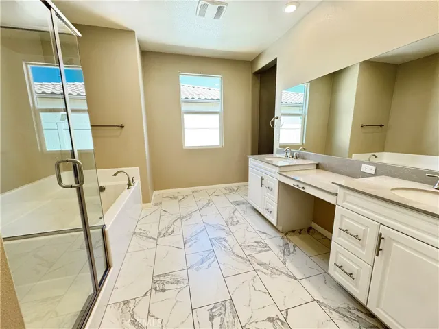 Master bathroom with Separate Shower & Tub and Dual Sinks
