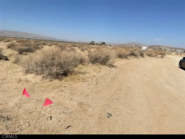 The property is marked with red flags