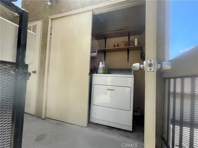 Washer/Dryer in your private space at top of stairs outside your unit behind the gate