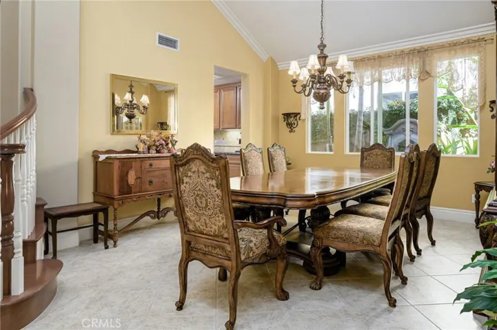 Large formal dining overlooking fountain and greenery