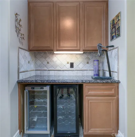 Butlers pantry with adjacent walk-in pantry
